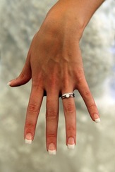Hand with diamond engagement ring